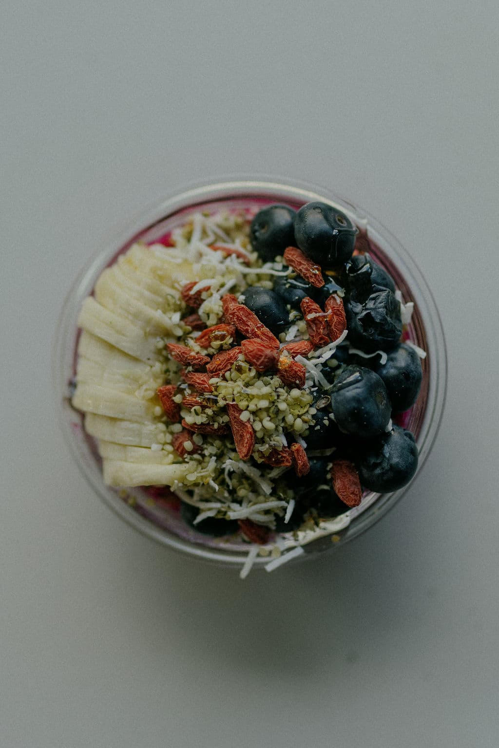 Overhead açaí cup with blueberries and banana
