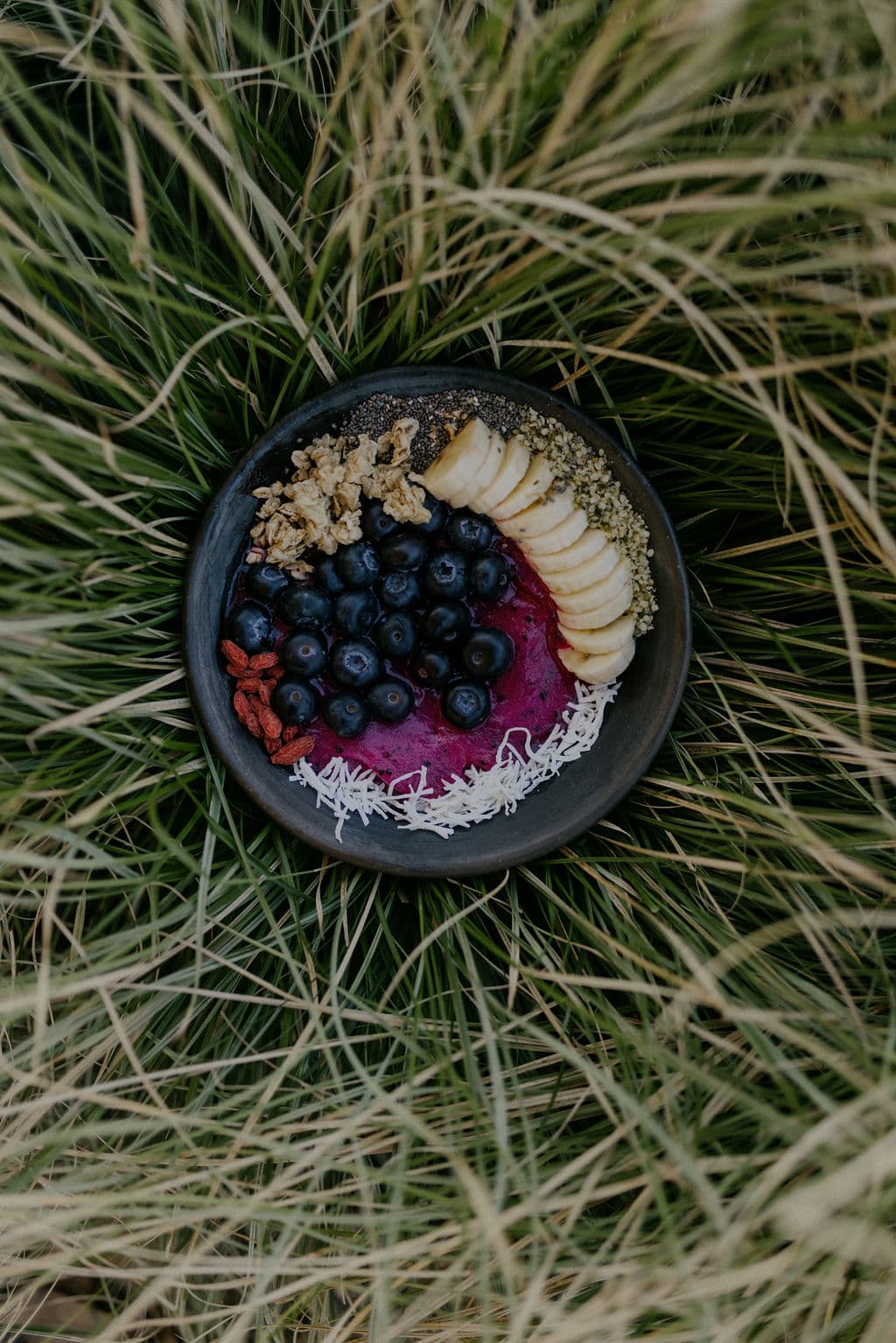 Açaí bowl styled on grass