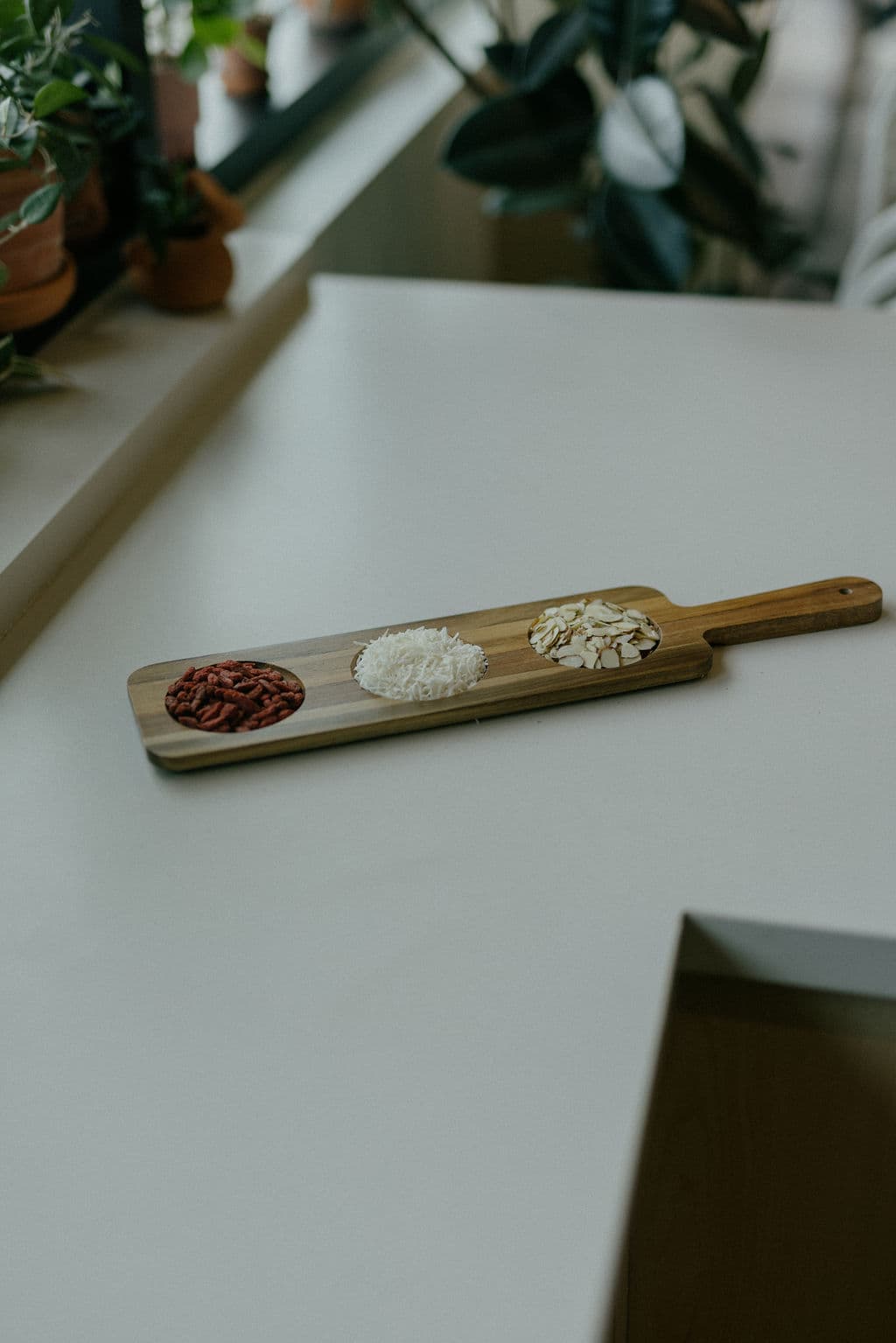 Toppings arranged on a wooden serving board